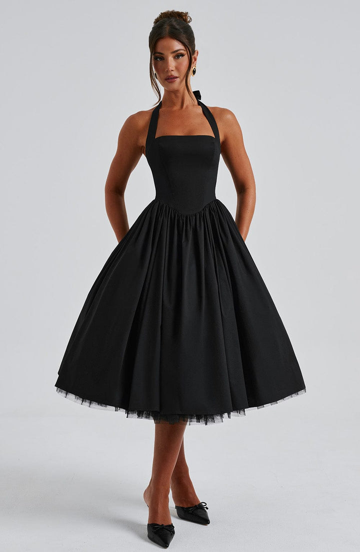 Black halter neck midi dress. A flattering and chic option for evening events and special occasions.