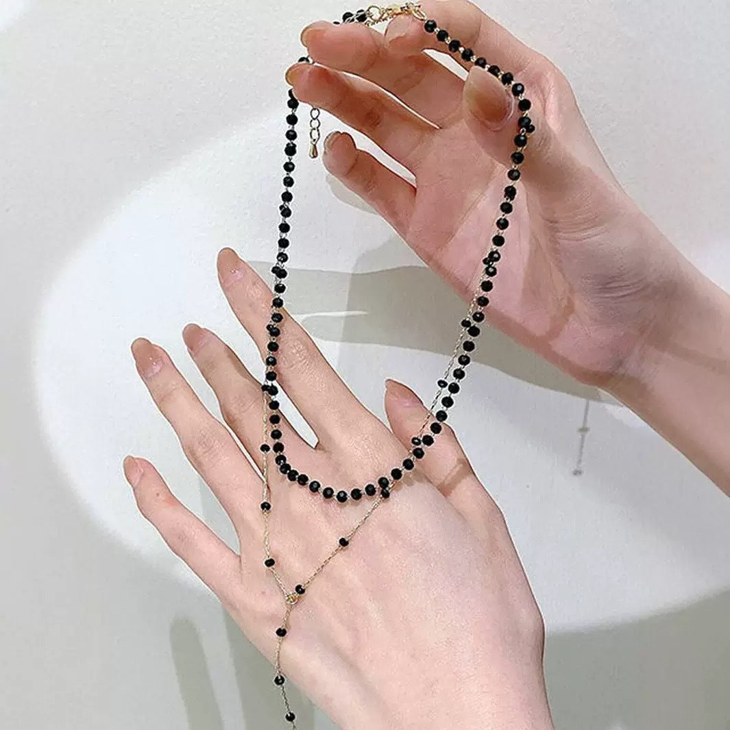 Fashionable black layered choker pendant necklace. Chic women's jewelry, perfect for elegant style.