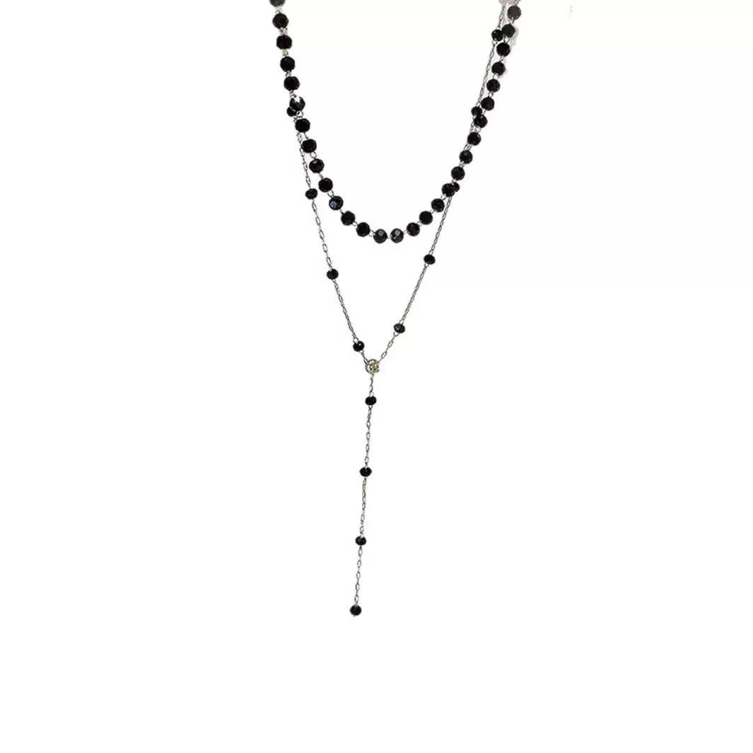 Trendy black layered choker pendant necklace for women. An elegant and chic fashion accessory.