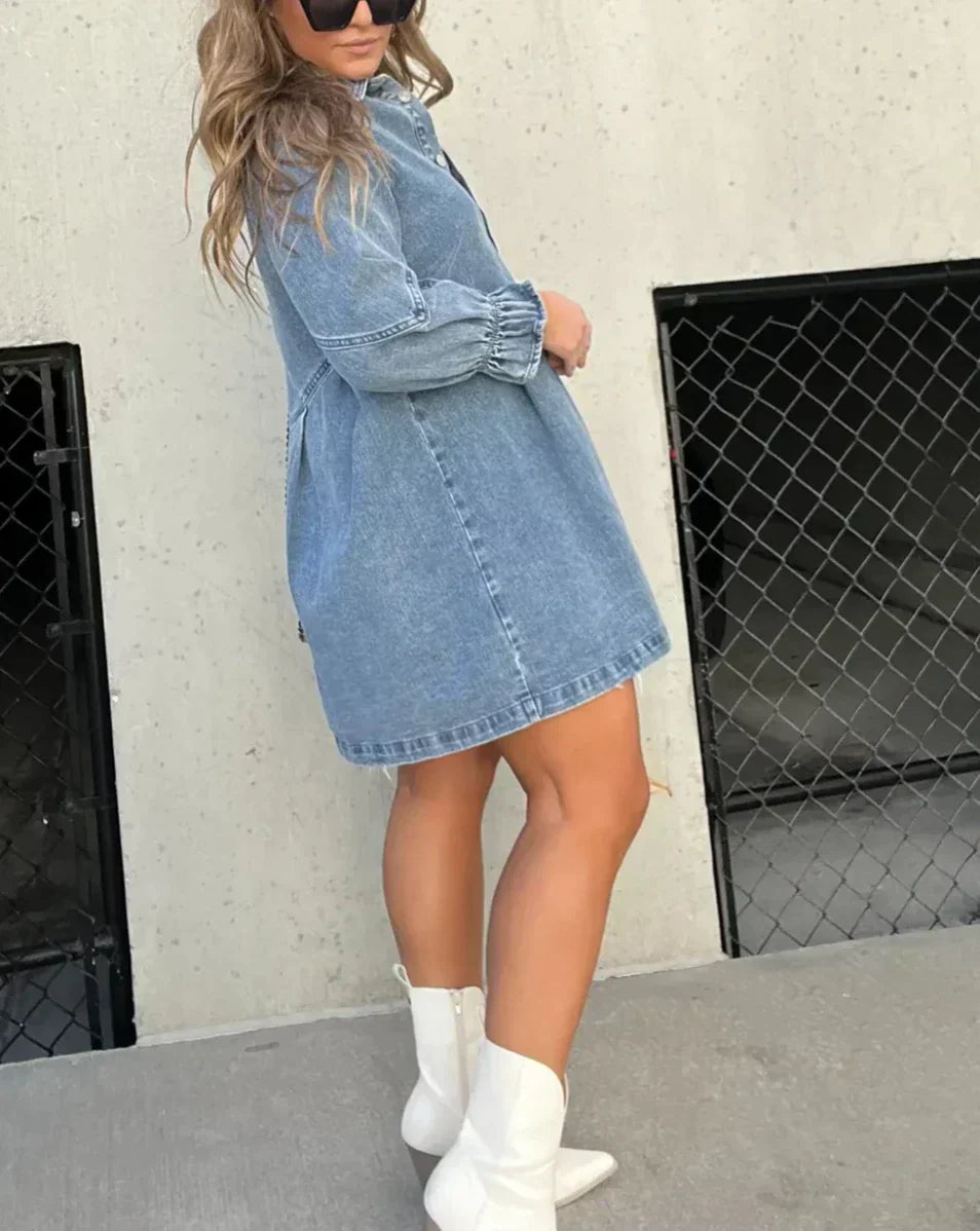 Fashionable women's mini denim dress, button-down front, ideal for casual summer days.
