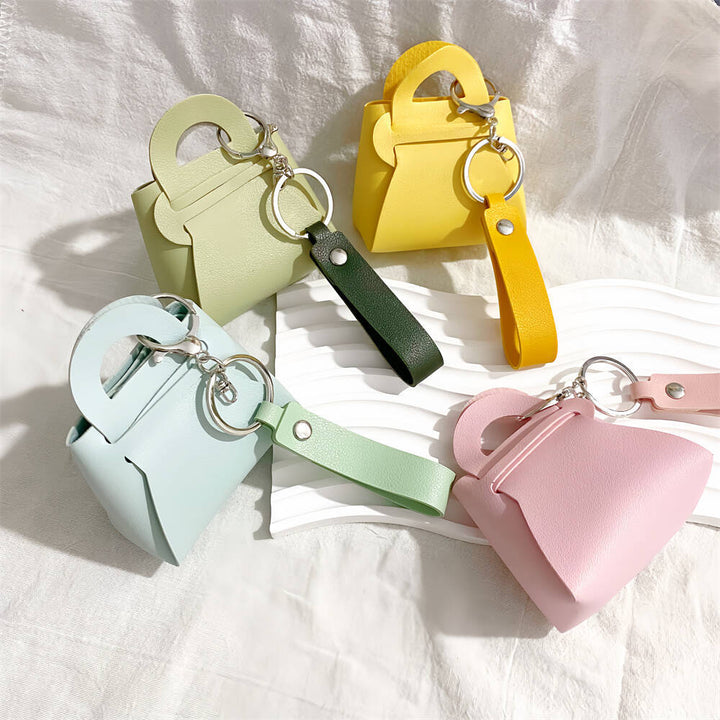 Chic faux leather mini handbag keychain for keys & bags. Stylish women's accessory.