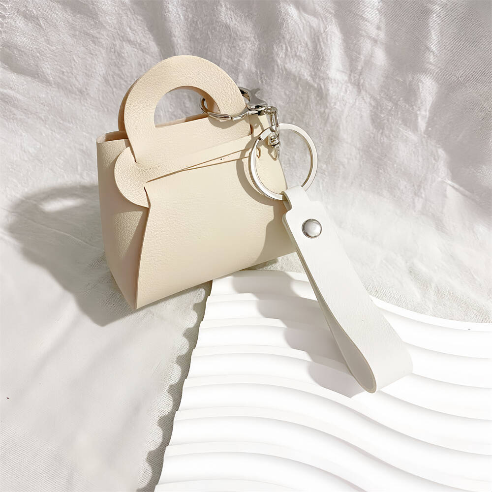 Sky blue faux leather mini handbag keychain. A stylish accessory for women's keys & bags.
