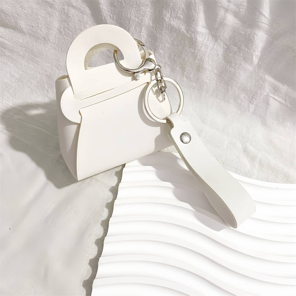 Colorful faux leather mini handbag keychains. A chic women's accessory & bag charm.