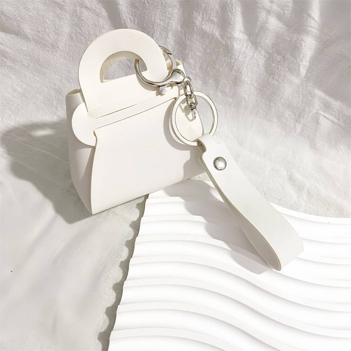 Colorful faux leather mini handbag keychains. A chic women's accessory & bag charm.