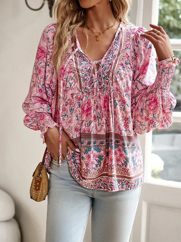 Chic floral blouse for women, perfect lightweight summer fashion with vibrant print.