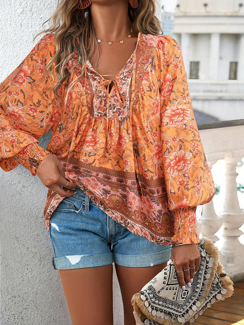 Relaxed fit women's floral blouse, vibrant short sleeve top, perfect for chic casual summer wear.