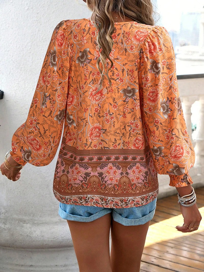 Elegant women's floral blouse, lightweight and vibrant short sleeve top, perfect for summer casual fashion.