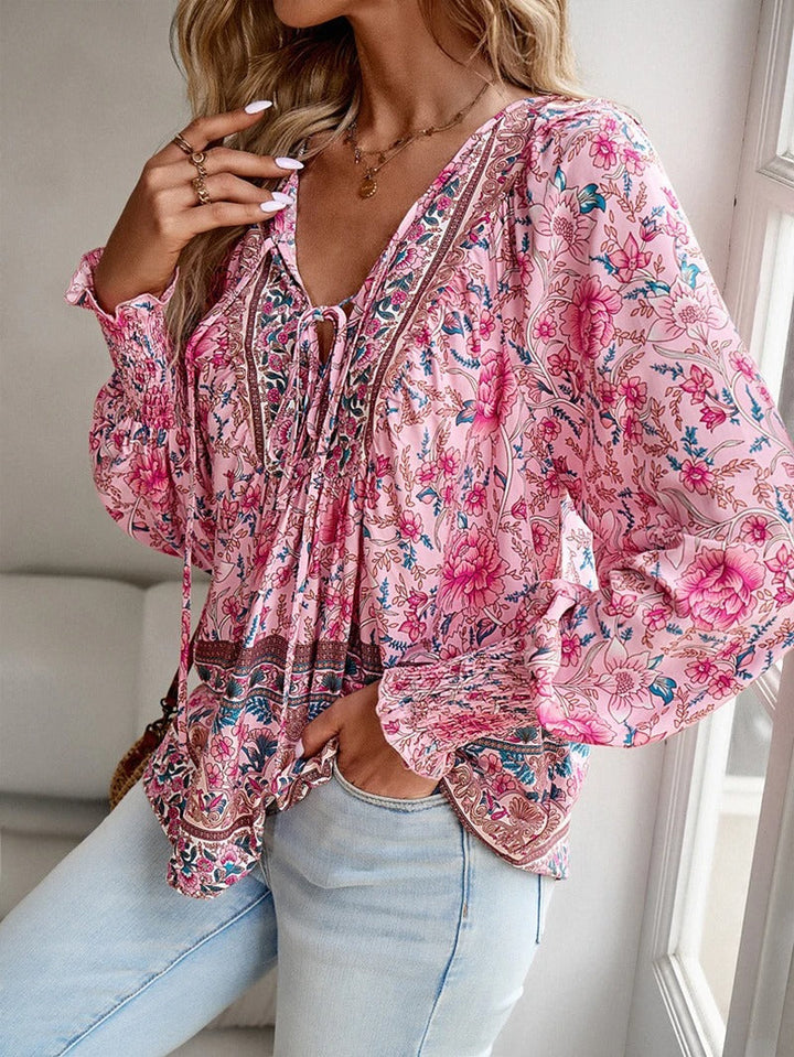 Lightweight short sleeve women's floral blouse, vibrant print, ideal for casual summer wear.