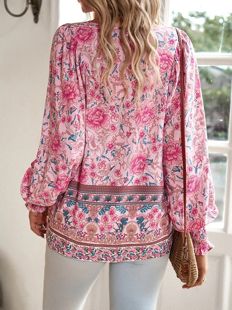 Versatile chic women's floral blouse, vibrant summer print, perfect for casual or dressed-up looks.