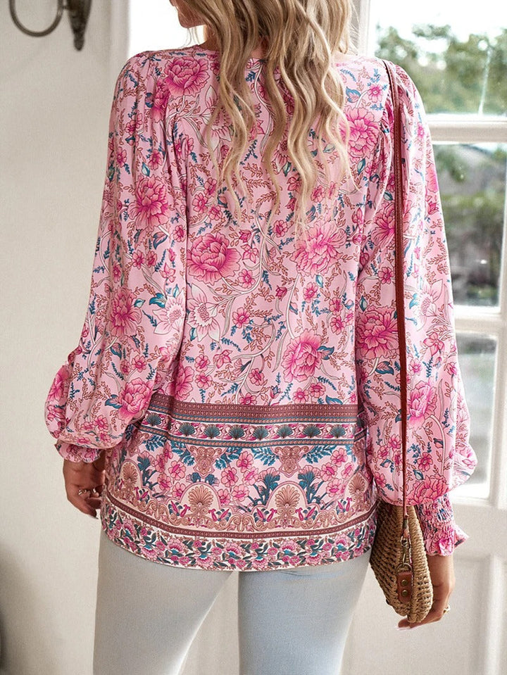 Versatile chic women's floral blouse, vibrant summer print, perfect for casual or dressed-up looks.