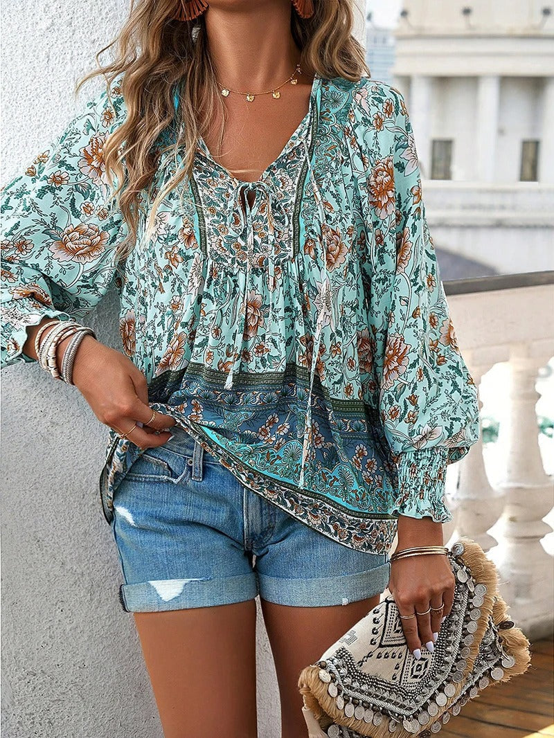 Vibrant floral print women's short sleeve blouse, a chic and lightweight top for summer fashion.