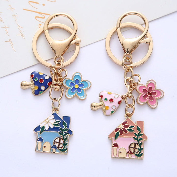 Chic floral house charm keychain, a cute women's accessory perfect for keys or bags.