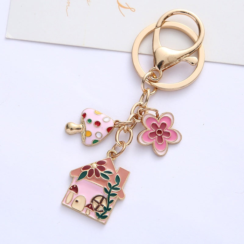 Decorative floral house keyring with vibrant enamel, a fashionable women's charm and gift idea.