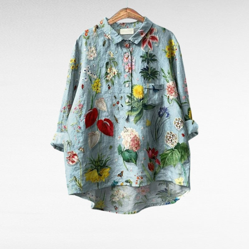 Chic light blue vintage women's summer blouse with relaxed fit, elegant & comfortable for casual or office wear.