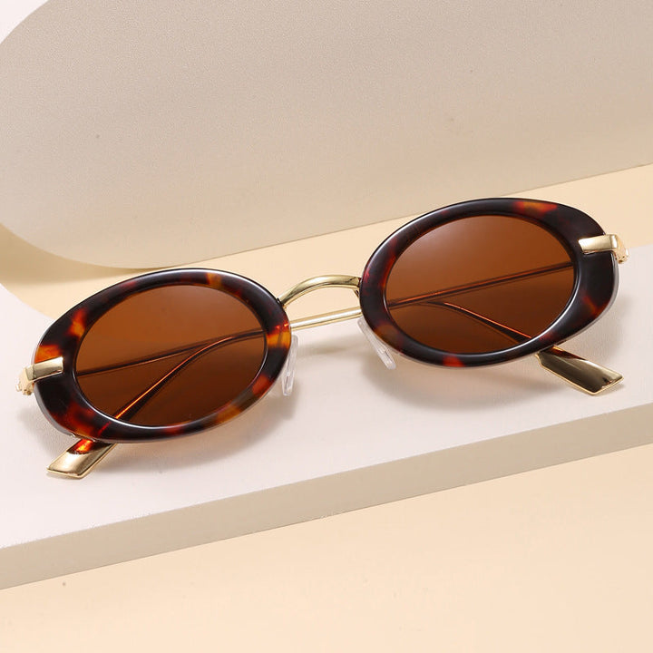 Stylish woman wearing modern chic oval frame fashion eyeglasses, perfect for any outfit.