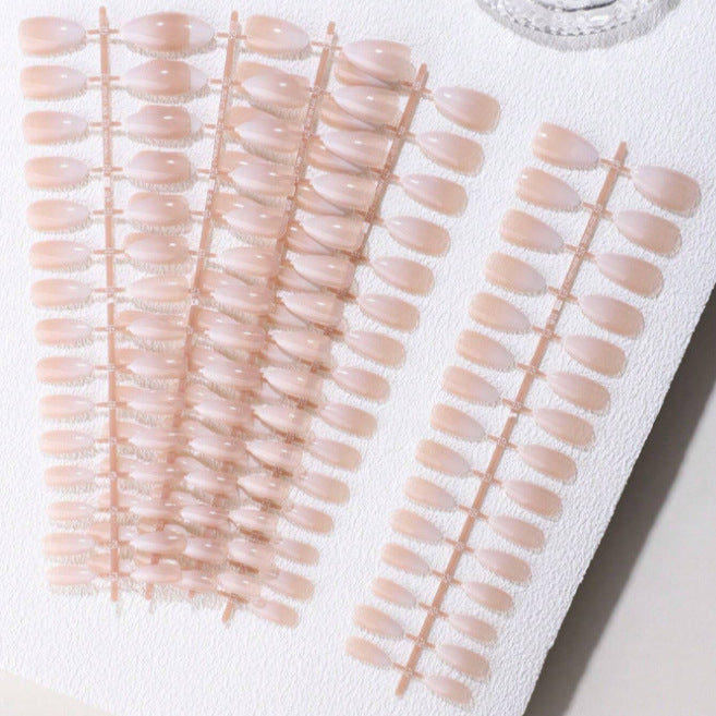 Chic press-on nails set for women, featuring a beautiful nude-pink shade, perfect for a quick, long-lasting manicure.
