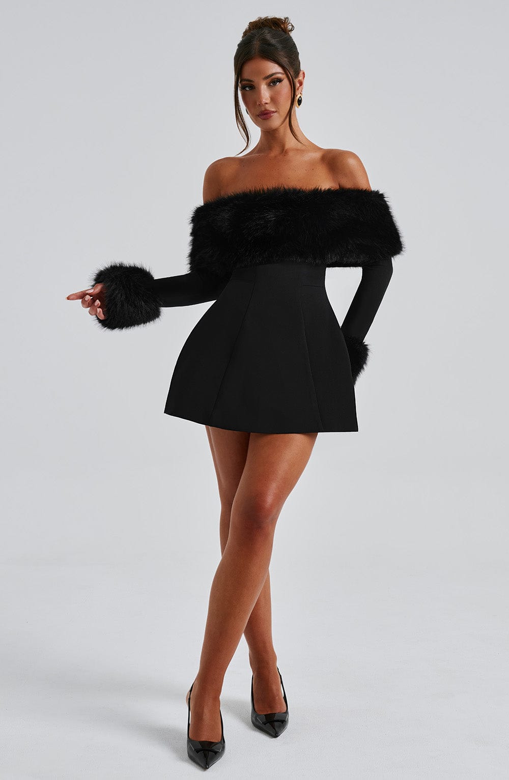 Women's elegant red off-shoulder dress featuring plush trim, perfect for a chic night out.