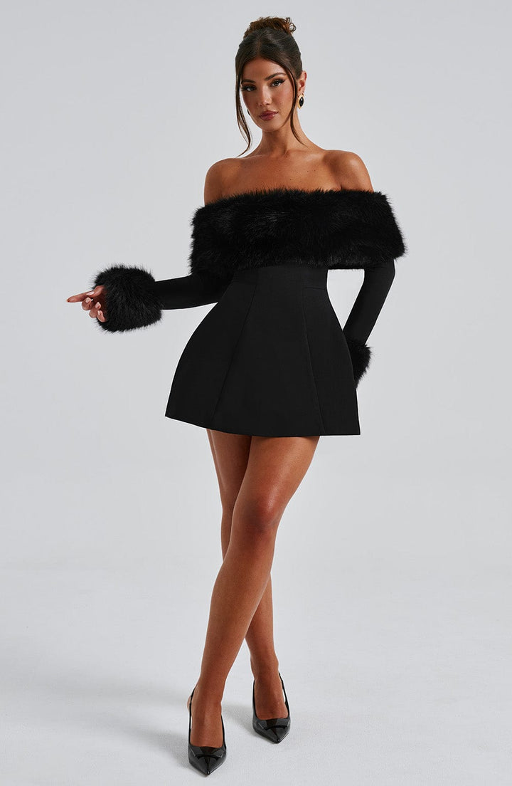 Women's elegant red off-shoulder dress featuring plush trim, perfect for a chic night out.