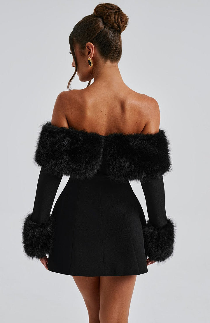 Glamorous red off-shoulder cocktail dress, featuring plush accents and a beautiful flare.