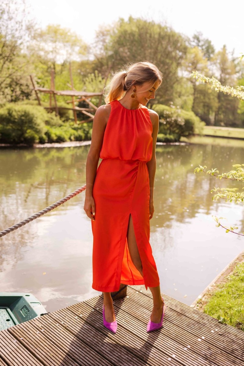 Womens apparel: chic sleeveless midi dress with front split. Comfortable and elegant for summer casual wear.