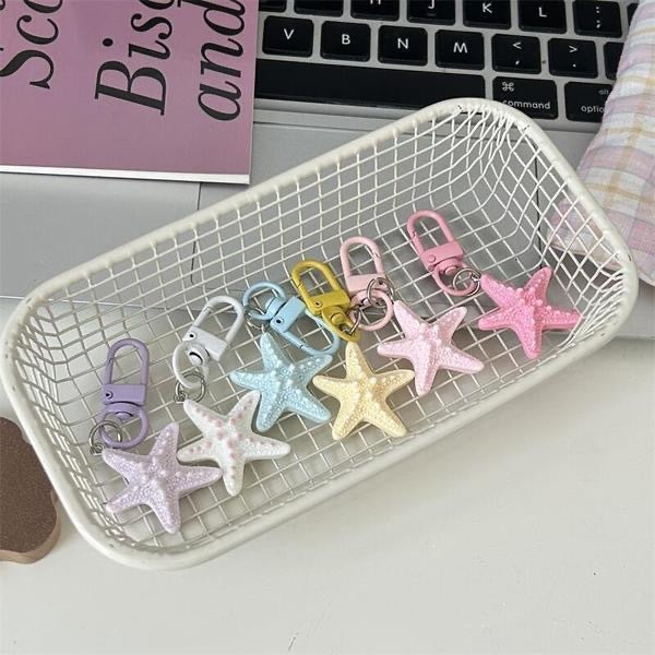 Chic star keychain, a vibrant bag charm for keys or purses. Durable and stylish fashion accessory.
