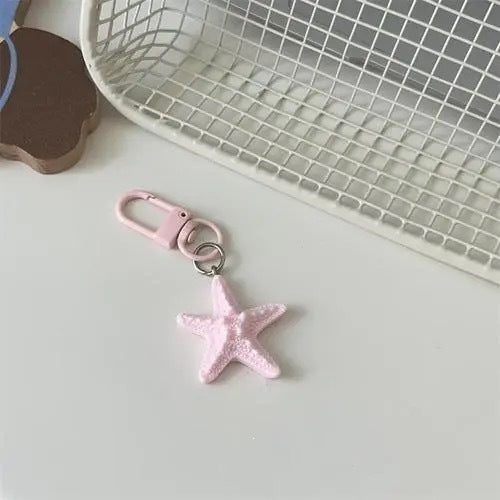 Chic star accessory, perfect as a keychain or bag charm. Durable construction and stylish look.