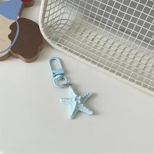 Trendy star keychain, a versatile bag charm for keys or handbags. Colorful and chic accessory.