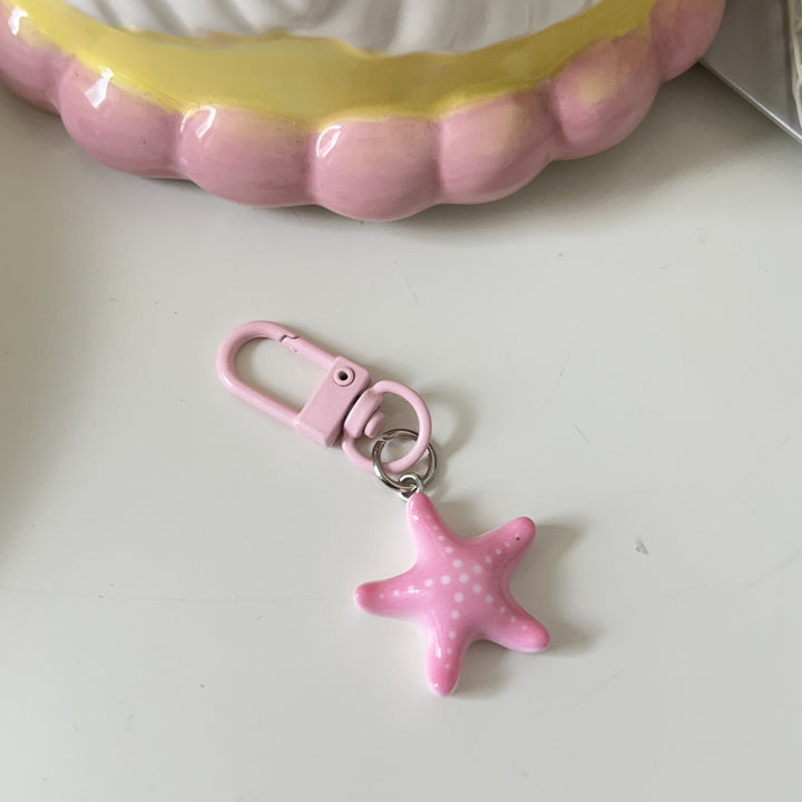 Colorful star keychain, a charming accessory for bags and keys. Adds a unique fashion touch.