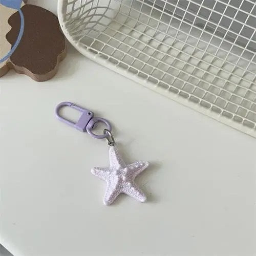 Elegant star keychain for bags & keys. Unique design and durable construction.