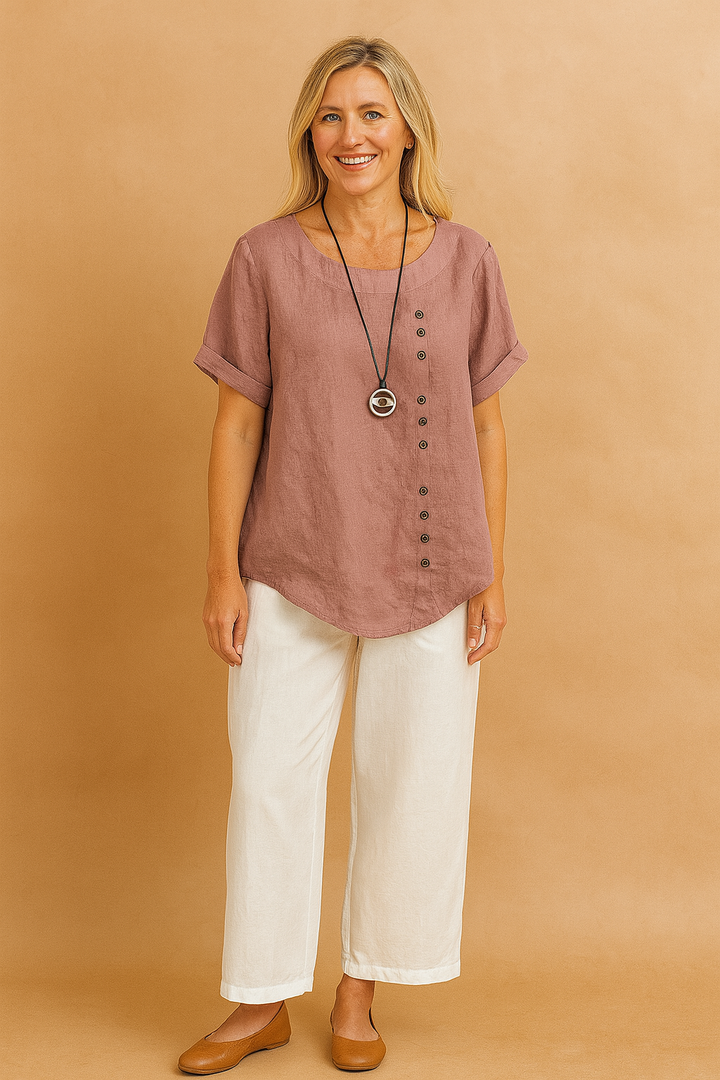 Chic women's asymmetrical blouse with unique clasp detail, short sleeve top.