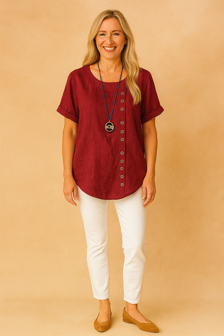 Pink women's asymmetrical short sleeve blouse, elegant top with unique clasp.