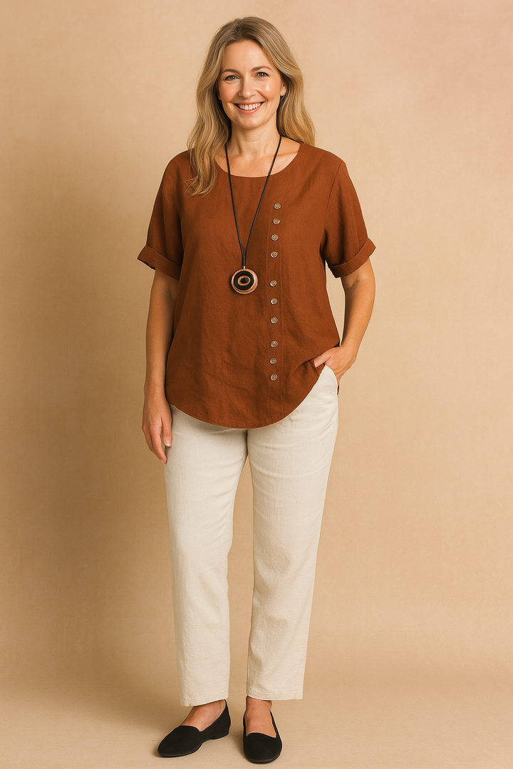 White modern asymmetrical short sleeve blouse for women, unique decorative clasp.