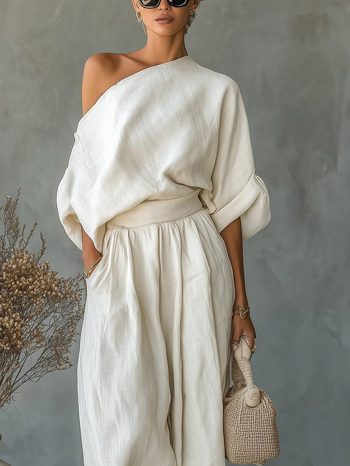 Women's casual chic off-shoulder trouser set in beige. Perfect for comfortable, versatile fashion. Elegant loungewear.