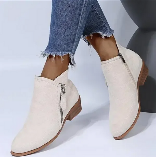 Versatile women's black ankle boots with zipper, a chic & comfortable choice for autumn-winter fashion.