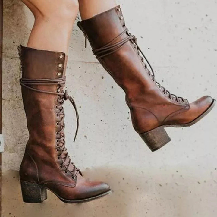 Elegant women's lace-up knee-high boots in black, offering stylish and comfortable tall footwear for fall and winter fashion.