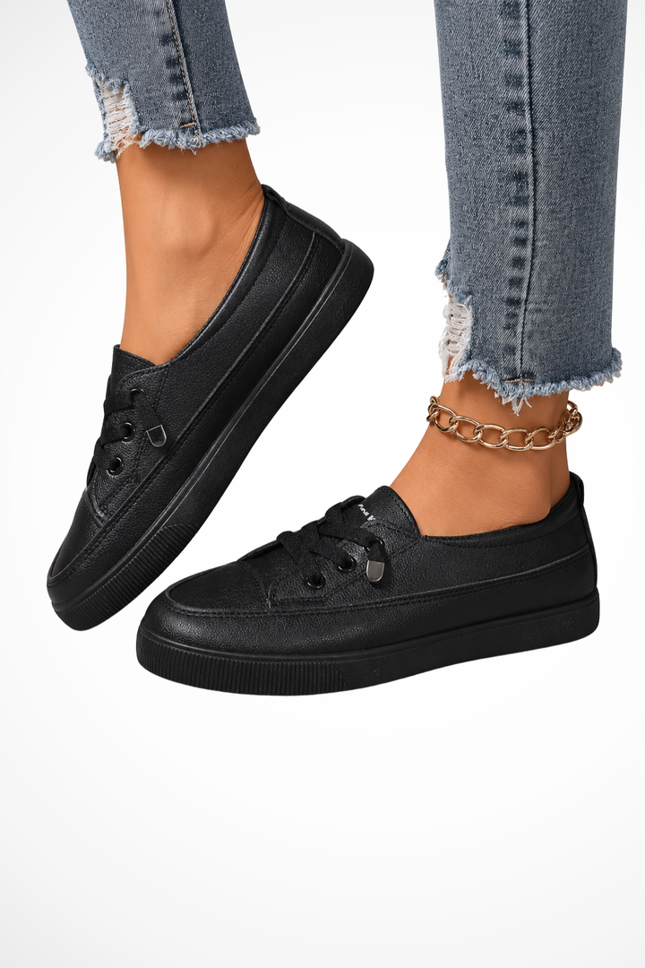 Comfortable women's white slip-on sneakers, ideal for casual everyday style & easy wear.