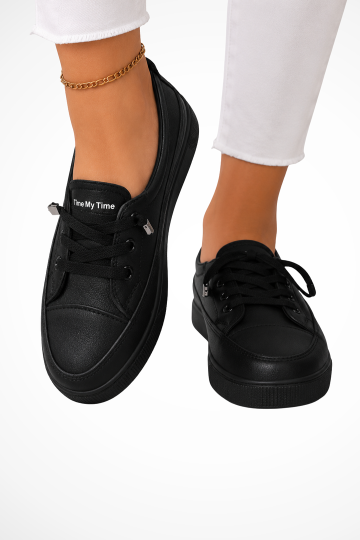 Everyday women's black slip-on sneakers, offering chic style and supreme comfort for casual outfits.