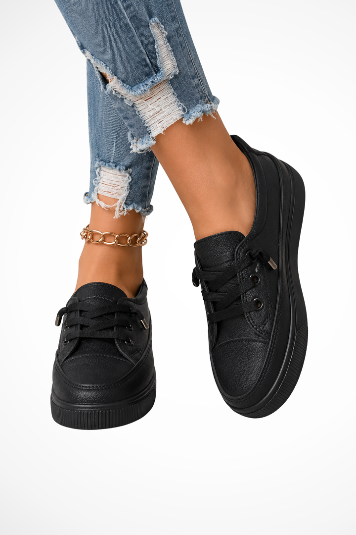 Stylish women's beige slip-on sneakers, designed for comfortable, easy-to-wear casual footwear.