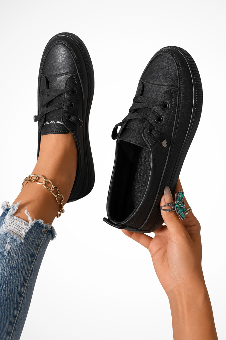 Comfortable & chic women's black slip-on sneakers, ideal for everyday casual footwear.