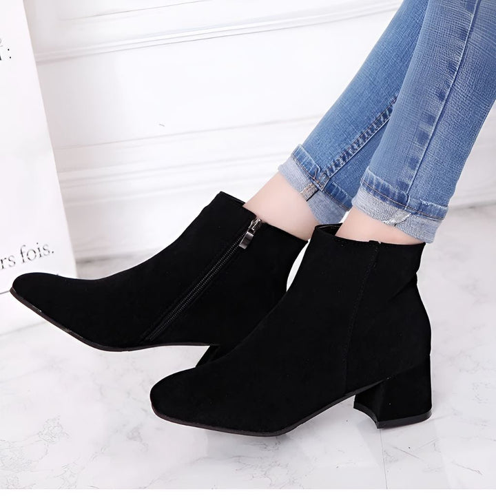 Versatile women's fashion ankle boots. Features a comfortable block heel & elegant pointed toe for chic style.