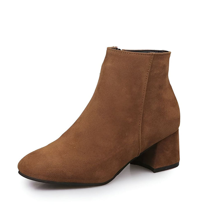 Stylish women's pointed-toe ankle boots with a stable block heel. Perfect for fall & winter outfits.
