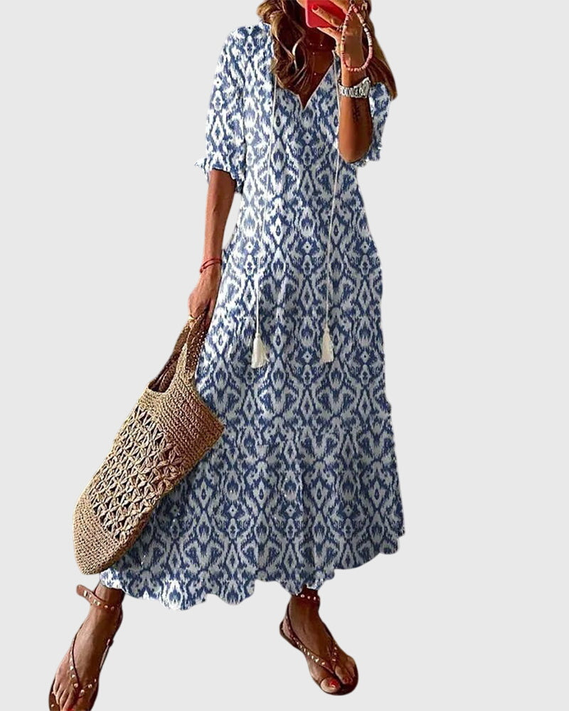 Chic women's bohemian vintage summer dress. Flowy midi sundress, perfect for beach, vacation, or casual wear.