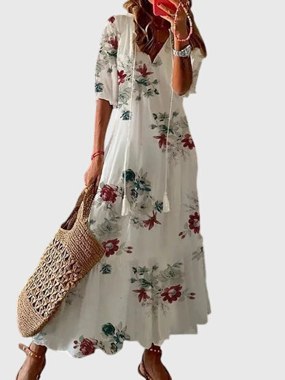 Women's V-neck bohemian summer dress. Flowy vintage midi sundress, perfect for beach trips & casual chic style.
