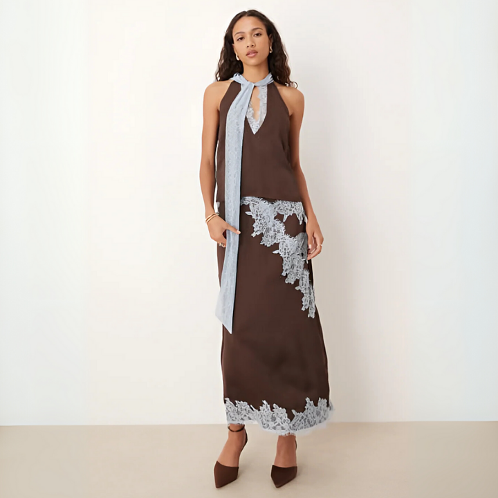 Chic women's brown halter top & flowy maxi skirt two-piece set, perfect for summer vacations or elegant evenings.