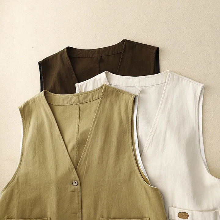 Relaxed fit women's vest, a versatile button-front layering piece with pockets for spring & casual outfits.
