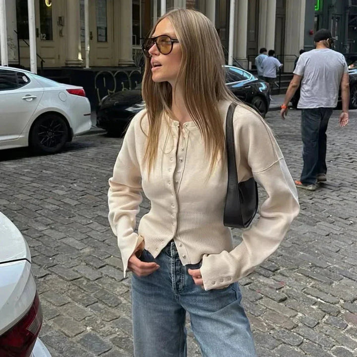 Elegant women's long-sleeve round neck cardigan with functional button-up front, ideal for casual wear.