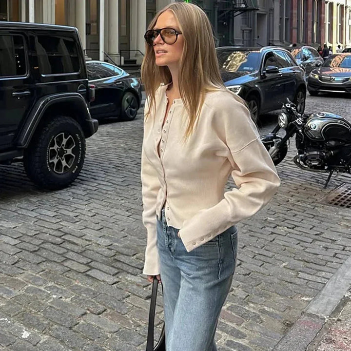 Versatile women's button-up cardigan for effortless layering; a chic round neck wardrobe essential.