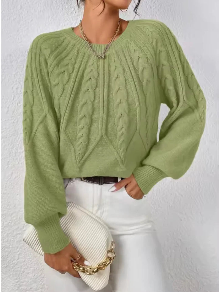 Chic women's cable textured pullover sweater with voluminous long sleeves & crew neck, perfect for autumn fashion.