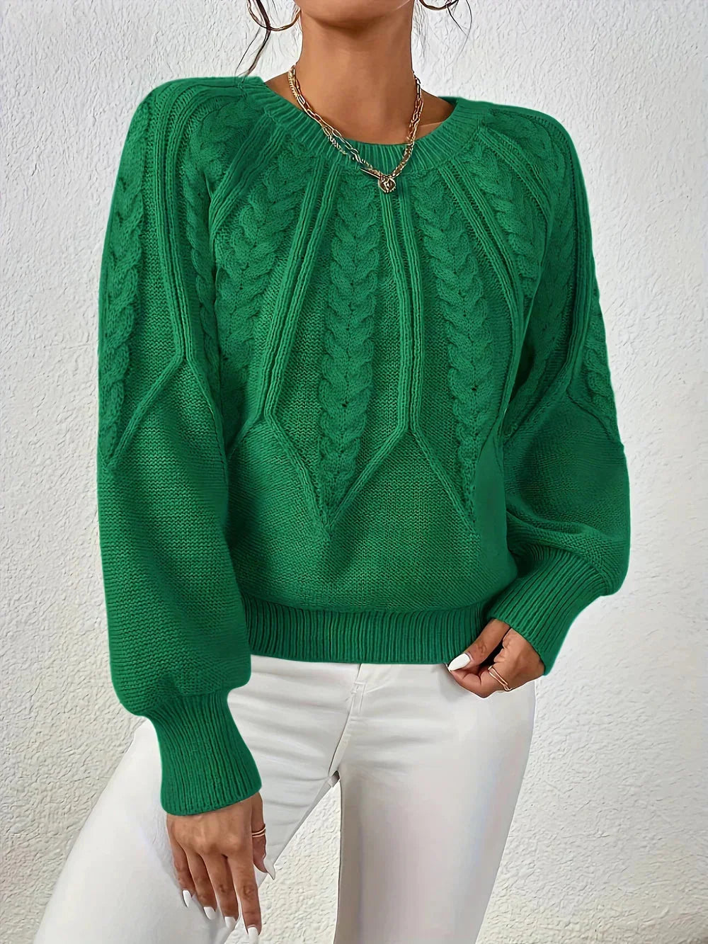 Autumn-ready women's cable knit pullover with chic voluminous sleeves, comfortable for everyday wear or special occasions.
