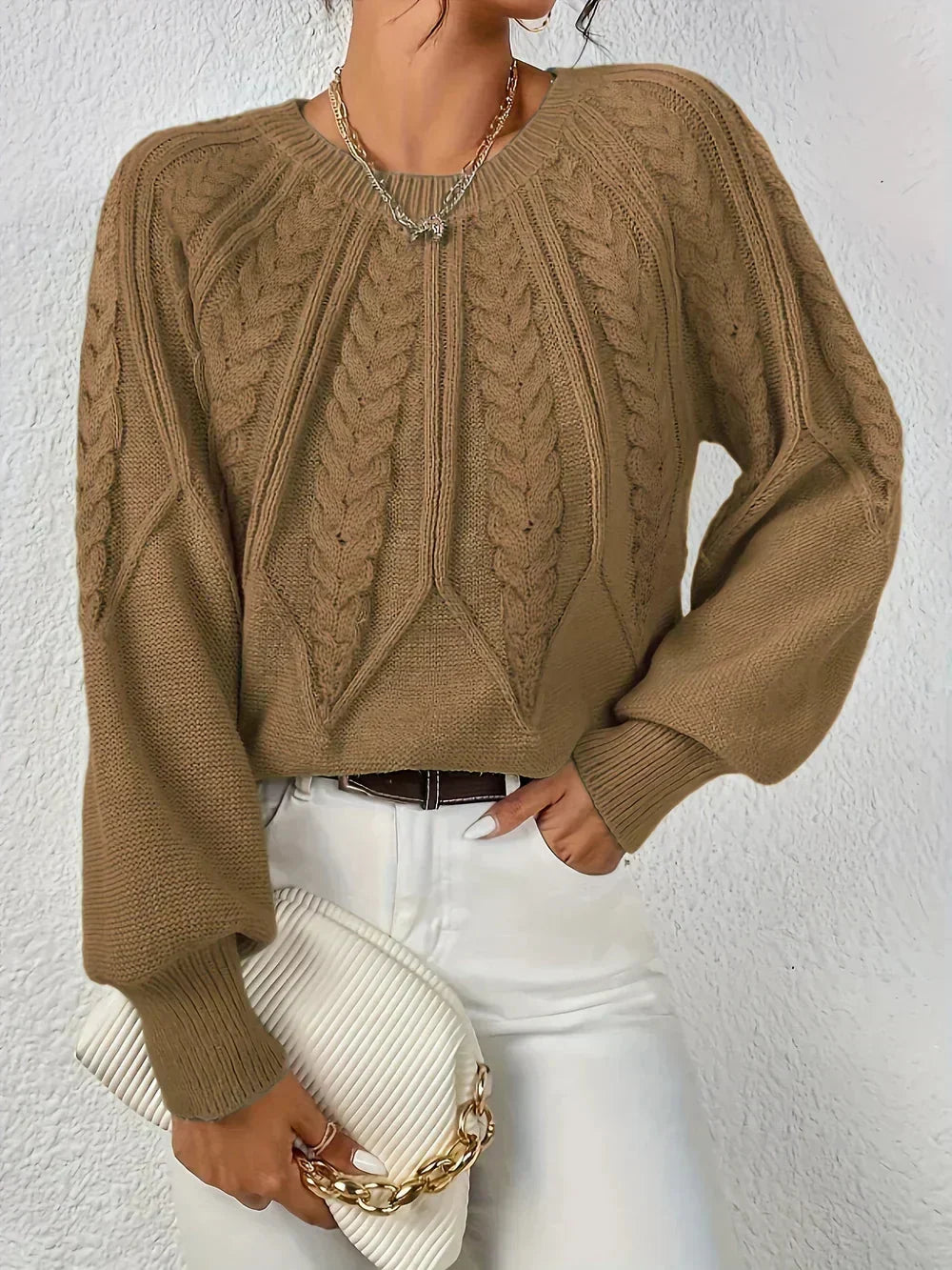Winter essential: Women's cable textured pullover. Elegant design, warm knit, and chic voluminous sleeves for cozy style.
